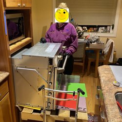 California Builder Distributors - Oven being slowly slid into the wall cabinetry with the teflon sheets making this very easy. Oven was at perfect height for installation.