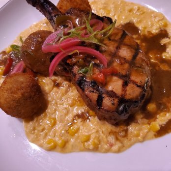 The Nest - Pork chop with corn and dirty rice arancini - Southern Near Me - Schenectady, New York The Nest - Pork chop with corn and dirty rice arancini - Southern Near Me - Schenectady, New York