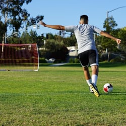 Classic XI Soccer Training - Coach Abraham demonstrating how to shoot the ball with power and accuracy.
