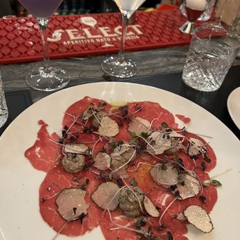 Sotto Sotto - CARPACCIO DI FILETTO | Beef tenderloin w/ fresh black truffle from Norcia and burrata Stracciatella cheese - Italian Near Me - Oakville, Ontario Sotto Sotto - CARPACCIO DI FILETTO | Beef tenderloin w/ fresh black truffle from Norcia and burrata Stracciatella cheese - Italian Near Me - Oakville, Ontario