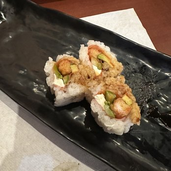 Sushi Tachi - 3 of 4 pieces of the JJ roll. Inside is crab tempura, asparagus, cream cheese, and avocado wrapped in soy paper topped with eel sauce. - Sushi Bars Near Me - North Las Vegas, Nevada Sushi Tachi - 3 of 4 pieces of the JJ roll. Inside is crab tempura, asparagus, cream cheese, and avocado wrapped in soy paper topped with eel sauce. - Sushi Bars Near Me - North Las Vegas, Nevada