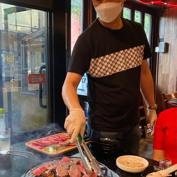 Ssam Tong - Owner making galbi for us. Cooked perfectly medium rare as requested. - Korean Near Me - Flushing, New York