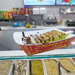 The Paleta Bar - Key Lime Paleta with dark chocolate drizzle, graham cracker dust and coconut shavings.