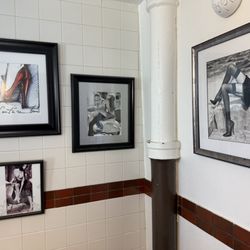 Francesco's Hole In the Wall - Some men's room decor.