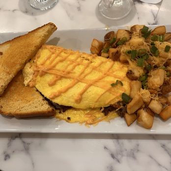 Breakfast at Ruiz - Tripleta omelet, came with toast and home fries. - Breakfast & Brunch Near Me - West Columbia, South Carolina Breakfast at Ruiz - Tripleta omelet, came with toast and home fries. - Breakfast & Brunch Near Me - West Columbia, South Carolina
