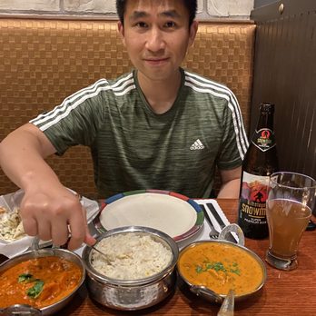 Bombay Palace - My husband and I enjoying butter chicken, his lamb curry, RICE, naan, and Indian beer - Indian Near Me - Murray, Utah