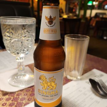 Rose-Thai Restaurant - a bottle of beer on a table - Thai Near Me - Toledo, Ohio Rose-Thai Restaurant - a bottle of beer on a table - Thai Near Me - Toledo, Ohio