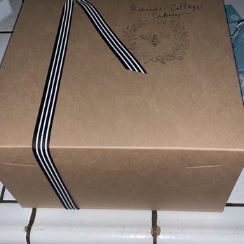 Beeside Cottage Cakery - a box with a ribbon tied to it - Custom Cakes Near Me Beeside Cottage Cakery - a box with a ribbon tied to it - Custom Cakes Near Me