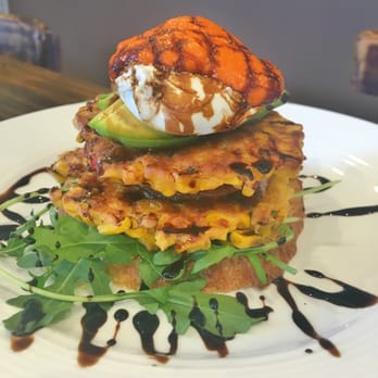 Kokkino Kafe - The Stack with mild chill corn fritters, avocado, poached egg, capsicum sauce - Cafes Near Me - Randwick, NSW Kokkino Kafe - The Stack with mild chill corn fritters, avocado, poached egg, capsicum sauce - Cafes Near Me - Randwick, NSW