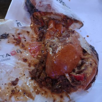 Casablanca - a half eaten sandwich on a white plate - American Near Me - Lake Ozark, Missouri