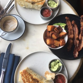 Death & Co - The food was really delicious. These are both the breakfast burrito and on the black plate is a side of potatoes, bacon, and avocado. - Cocktail Bars Near Me - Denver, Colorado