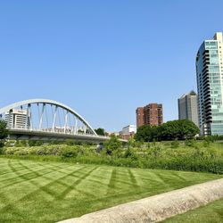 Genoa Park - Walking through the park with Columbus' Main Street Bridge and high rise buildings in the background.