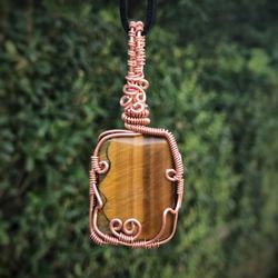 Mr Meerkat's Market - One of Mr Meerkat's Tiger Eye Pendans, hand wrapped with copper wire. Found online or right in the shop!