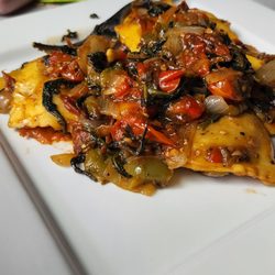 ZoJu - Red & green bell pepper sautee with caramlized white onions & baby spinach cooked cohesively with a mushroom ravioli.