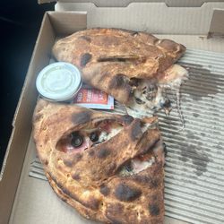 Calzone with ham pineapple and black olives.