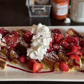 Farmer Franks - a plate of waffles with strawberries and whipped cream - Breakfast & Brunch Near Me - Detroit, Michigan