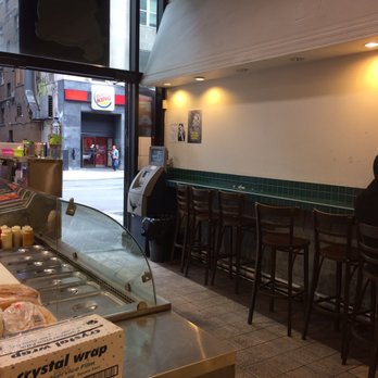Chennai Express - a man sitting at a counter in a restaurant - Indian Near Me - Montreal, Quebec