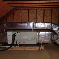 Siddall Heating & Cooling - Heat and a/c unit in a attic space. All duct work is out of the way for storage room.
