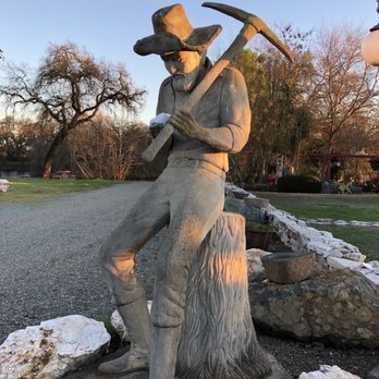 Immensee Vineyard Ranch - a statue of a farmer with a picker - Ranches Near Me - Elk Grove, California