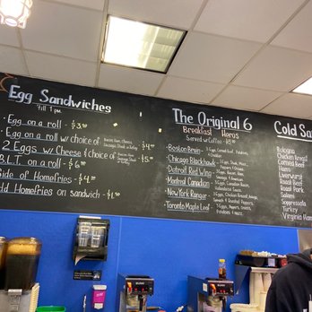 Brand's Deli - a man standing in front of a menu - Delis Near Me - Long Beach, New York Brand's Deli - a man standing in front of a menu - Delis Near Me - Long Beach, New York