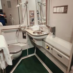 Amtrak - Private bathroom suite was styled after Asian bathroom with only a shower spray and floor drain, not a shower stall