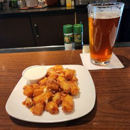 Cheese curds and an amber Cheese curds and an amber