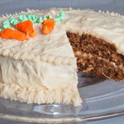 Savvy Treats - Classic Carrot cake: made with carrots, walnuts, coconut and pineapple topped with fresh whipped cream cheese frosting.