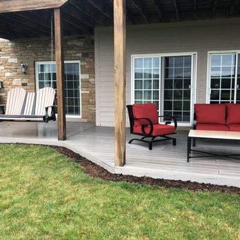 Luke Contracting Services - a patio with a swing and chairs - General Contractors Near Me Luke Contracting Services - a patio with a swing and chairs - General Contractors Near Me
