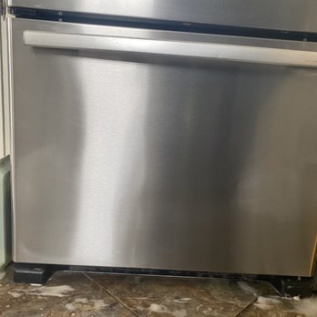 ICC Home Cleaners - AFTER: Food/liquid stains on stainless steel freezer door. Gently degreased, scrubbed, wiped clean, and POLISHED. - Home Cleaning Near Me