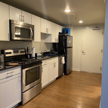 Harbor Steps Apartments - Full kitchen in the hallway. - Apartments Near Me - Seattle, Washington Harbor Steps Apartments - Full kitchen in the hallway. - Apartments Near Me - Seattle, Washington