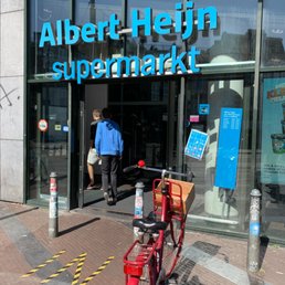 One of the main entrances to the underground grocery store. Somewhat RUDE to park a bike there. Notice there are now IN and OUT on each door