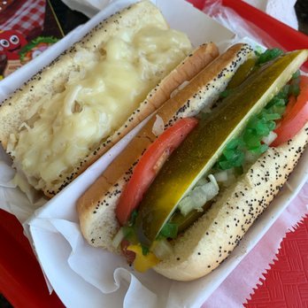 Hotdogopolis - Reuben Regular Hot Dog on left and Chicago Regular Hot Dog on the right. Both delicious. - Hot Dogs Near Me - Boca Raton, Florida Hotdogopolis - Reuben Regular Hot Dog on left and Chicago Regular Hot Dog on the right. Both delicious. - Hot Dogs Near Me - Boca Raton, Florida