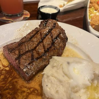 LongHorn Steakhouse - Half of New York Strip and Mashed Potatoes lol I dug in quick - Steakhouses Near Me - Spring, Texas