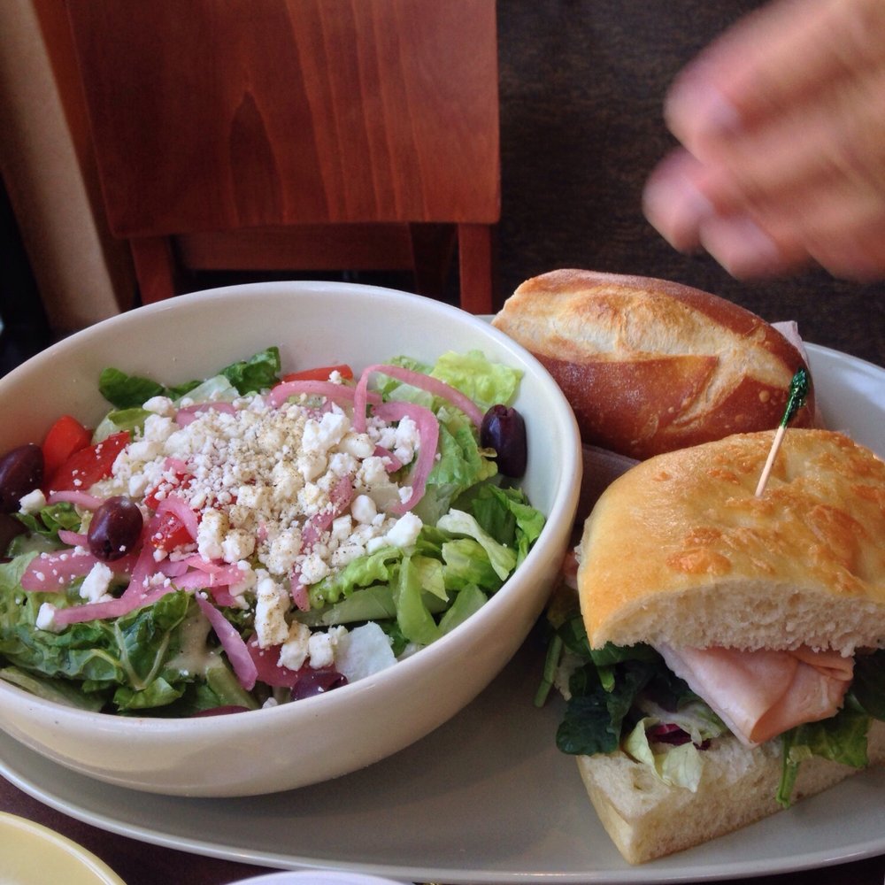 Panera Bread - Combo: half turkey Sonora sandwich and half Greek salad with the side of baguette slice. Check out the size of the yummy salad. :) - Sandwiches Near Me - Sacramento, California Panera Bread - Combo: half turkey Sonora sandwich and half Greek salad with the side of baguette slice. Check out the size of the yummy salad. :) - Sandwiches Near Me - Sacramento, California