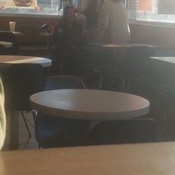 McDonald's - Employee taking pictures and helping someone do hair where you eat. Very unsanitary. Employee was there well over 10 min.