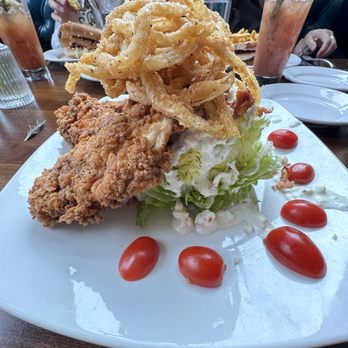 Amaro's Table - Wedge Salad with Blue Cheese, fried onions, tomato's and 1 piece of fried chicken.  Amazing!! - New American Near Me - Vancouver, Washington