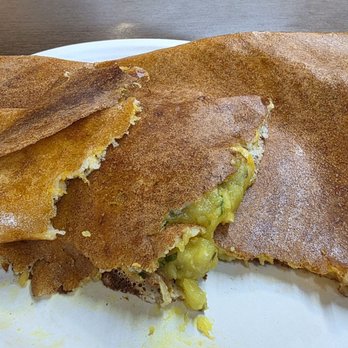 Radhe Authentic Indian Restaurant - The spiced potato filling inside the Cheese Masala Dosa - Indian Near Me - Riverview, Florida Radhe Authentic Indian Restaurant - The spiced potato filling inside the Cheese Masala Dosa - Indian Near Me - Riverview, Florida