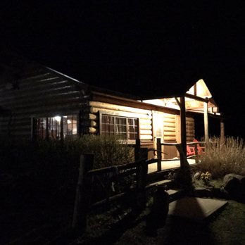 Creekside Lodge Yellowstone - Lodge Front door at night - Guest Houses Near Me - Cody, Wyoming Creekside Lodge Yellowstone - Lodge Front door at night - Guest Houses Near Me - Cody, Wyoming