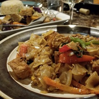 Thai Square - Pad kee mow with tofu, spicy eggplant with tofu in back - Thai Near Me - Denton, Texas Thai Square - Pad kee mow with tofu, spicy eggplant with tofu in back - Thai Near Me - Denton, Texas