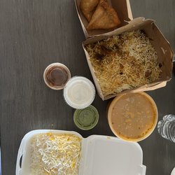Nawab’s Indian Cuisine - Veggie Samosa, Nawabs Chef Special Chicken Dum Biryani,  Murgh Tikka Kabab which comes with rice.