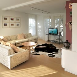 The Art Colony Beach Apartments - Spacious living room, mid-century style in our Artist's Loft apartment.