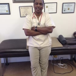 Moses Chiropractic - Here I stand next to one of the many tables and/or services that I provide. So come on done & let's see how I can help you!