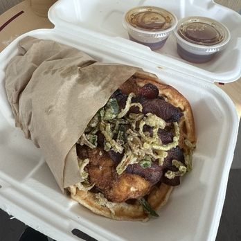 Waffle Champion - Chicken and Waffles with crunchy leeks and Tabasco infused syrup. - Waffles Near Me - Oklahoma City, Oklahoma