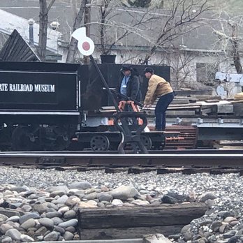 Nevada State Railroad Museum - Carson City - Monday, April 15, 2019: man taking the hand push cart on the railroad track for a quick ride. - Museums Near Me - Carson City, Nevada