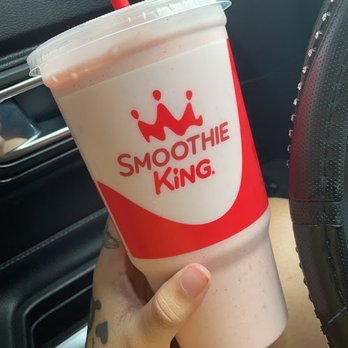 Smoothie King - a hand holding a smoothie cup - Juice Bars & Smoothies Near Me - Blue Springs, Missouri Smoothie King - a hand holding a smoothie cup - Juice Bars & Smoothies Near Me - Blue Springs, Missouri