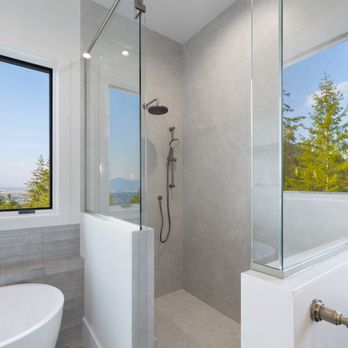 Onyx & Oak Homes - Modern walk-in shower with large-format tile and natural light - thoughtful design and precise execution. - General Contractors Near Me - Post Falls, Idaho Onyx & Oak Homes - Modern walk-in shower with large-format tile and natural light - thoughtful design and precise execution. - General Contractors Near Me - Post Falls, Idaho