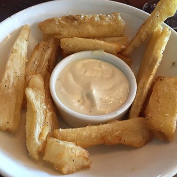 MIA Kitchen & Bar - (lightly) Fried Yucca. Garlicky dipping sauce. - New American Near Me - Delray Beach, Florida MIA Kitchen & Bar - (lightly) Fried Yucca. Garlicky dipping sauce. - New American Near Me - Delray Beach, Florida