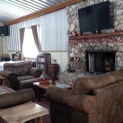 Wild Frontier RV Resort - Lodge Fireplace Seating Area