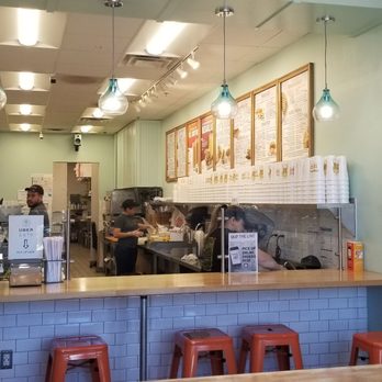 Tropical Smoothie Cafe - 10/28/19Katalina ( with the long hair) is making my drink of blueberries, spinach, kale and peaches. No added sugar. - Juice Bars & Smoothies Near Me - Fairfax, Virginia
