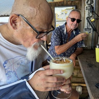 Island Breeze - I'm having a piña colada with three shots of rum, which is called rocket fuel in the background is my friend Bob - Seafood Near Me - Cherry Grove, New York Island Breeze - I'm having a piña colada with three shots of rum, which is called rocket fuel in the background is my friend Bob - Seafood Near Me - Cherry Grove, New York